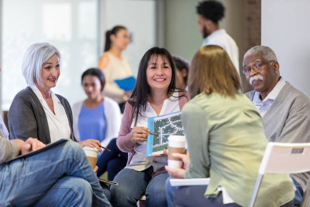 Thumbnail for the Citizen Patient and Community led knowledge with impact research cluster, depicting a group of people seated together in conversation